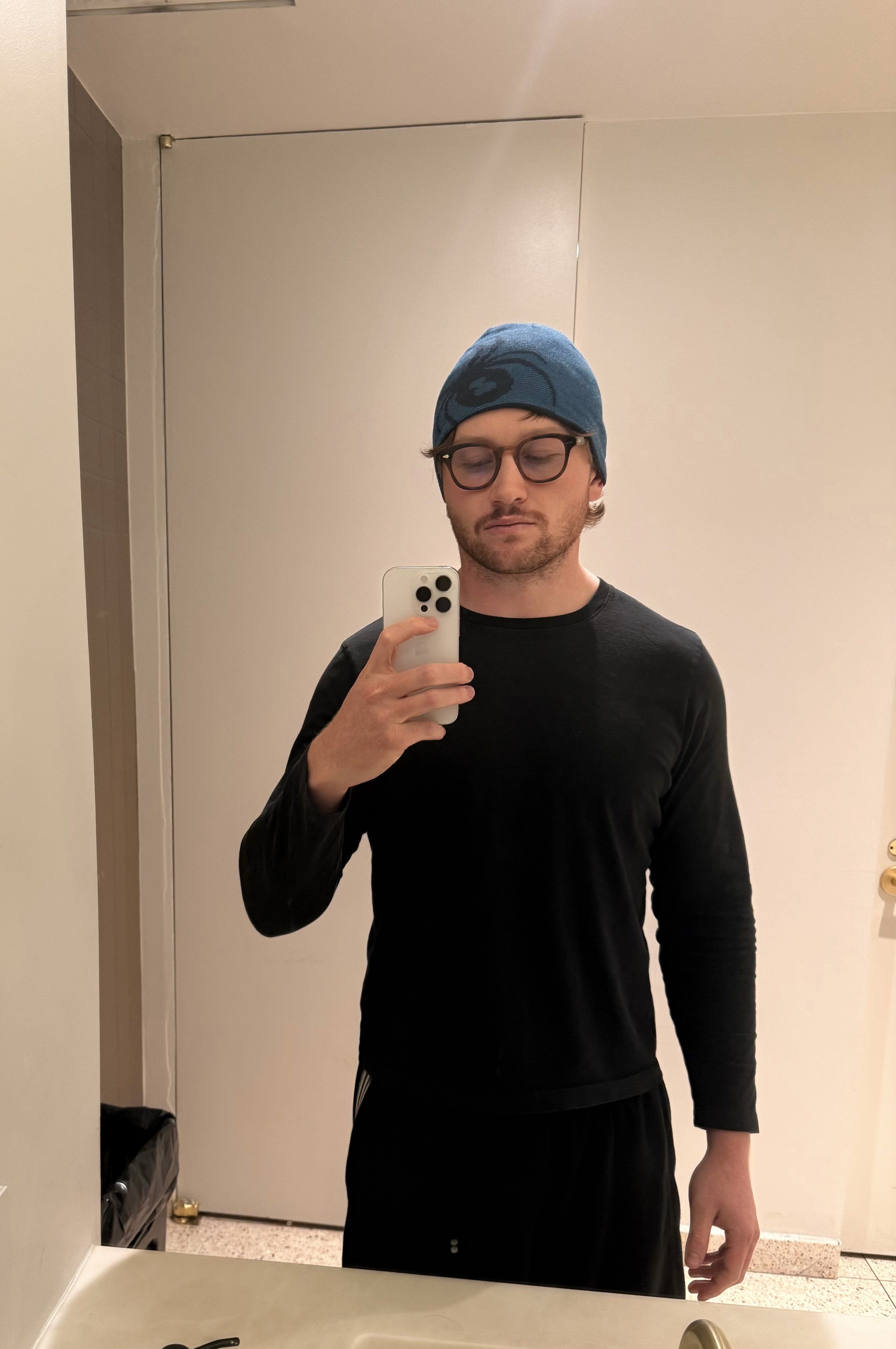Man in black shirt and blue beanie