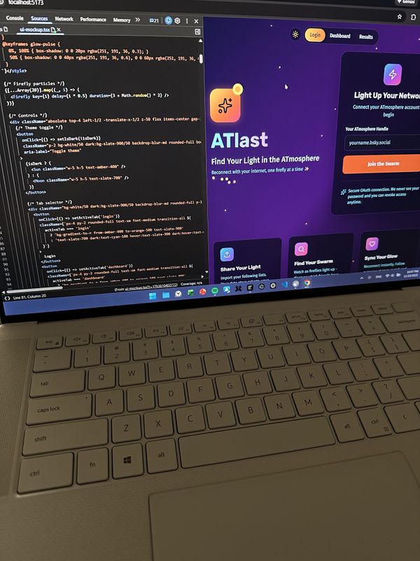 photo of my computer screen with ATlast open on the right, and the source code open on the right. here i am showing the dark mode coloring of the ATlast home page which is my favorite and i hope everyone uses dark mode tbh it’s just better. the background is a deep purple gradient with cyan text and orange accents.